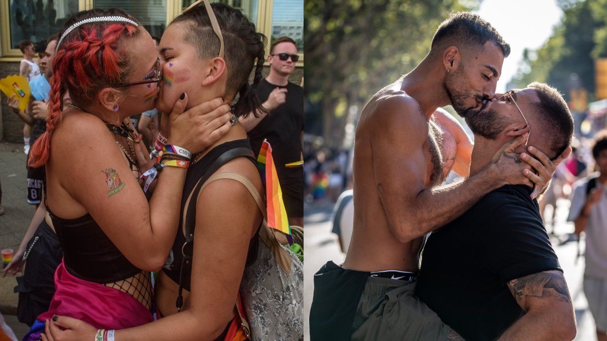 A couple kisses in the middle of the street during the Christopher Street Day ; Men seen kissing during the 2023 Pride Barcelona Parade.