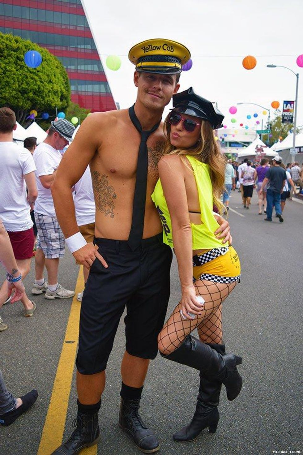 A couple wearing costumes at LA Pride. 