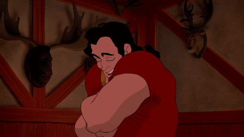 A gif of Gaston from Disney's 'Beauty and the Beast' showing off his chest hair. 