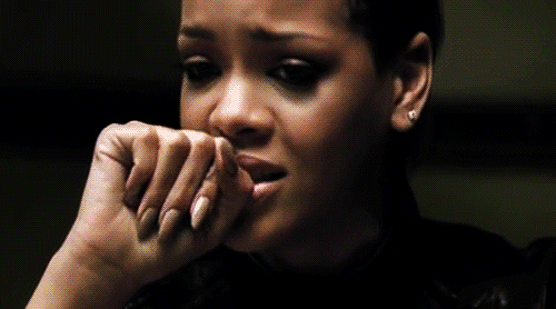 A gif of Rihanna looking upset.