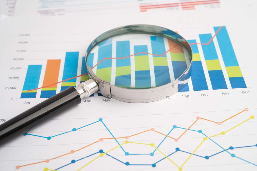 A graph and a magnifying glass