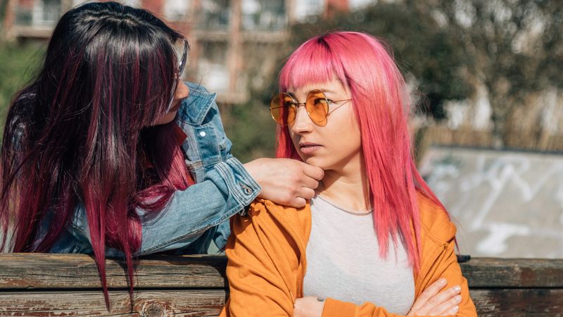 a lesbian holdin the chin of another lesbian