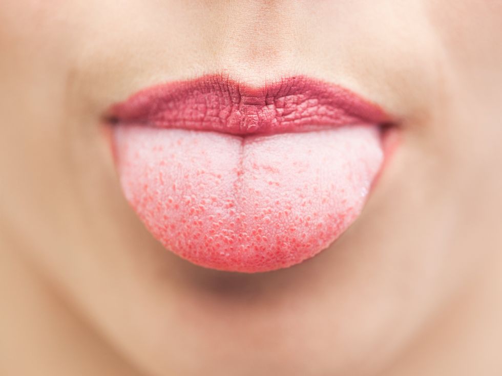 a woman sticking out her tongue