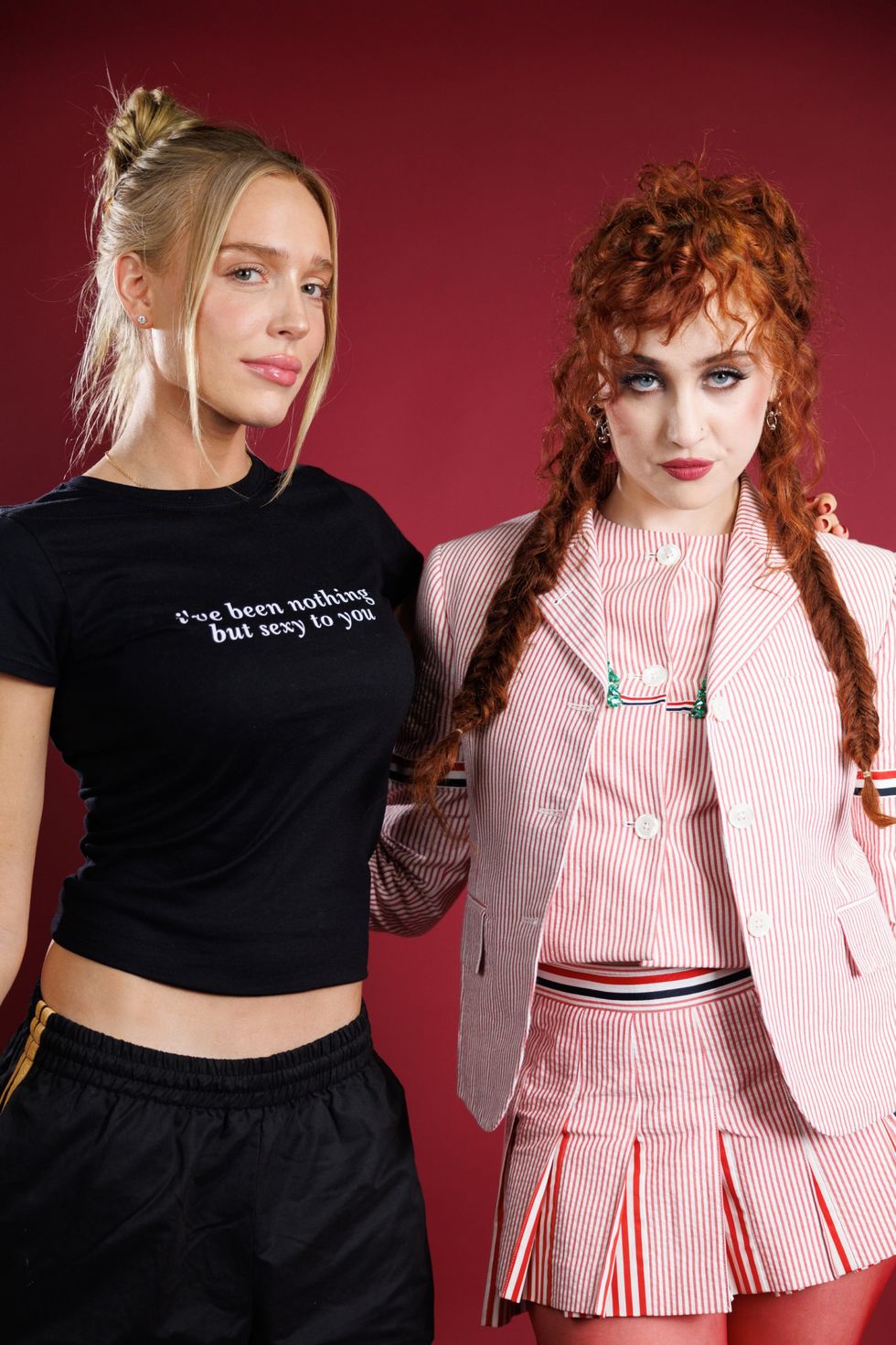 Alex Cooper and Chappell Roan posing together for the Call Her Daddy podcast