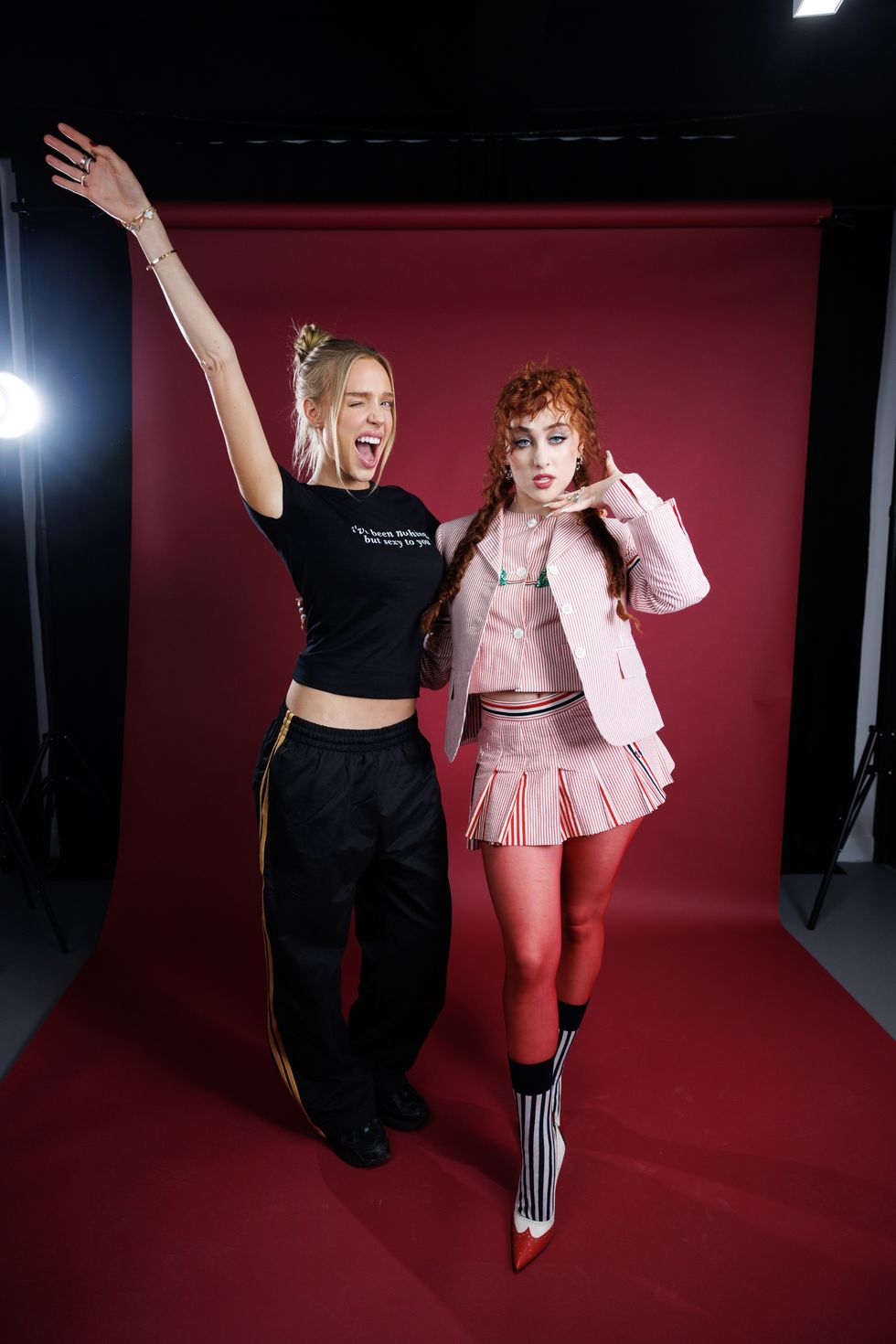 Alex Cooper and Chappell Roan posing together for the Call Her Daddy podcast