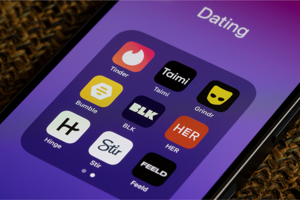 An iPhone open to a folder of apps titled "Dating" which includes Tinder, Taimi, Grindr, Bumble, BLK, HER, Hinge, Stir, and Feeld.