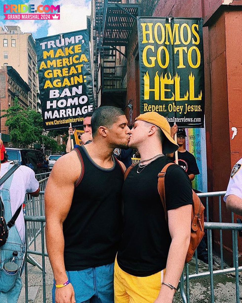 Anthony and michael kiss in front of protestors