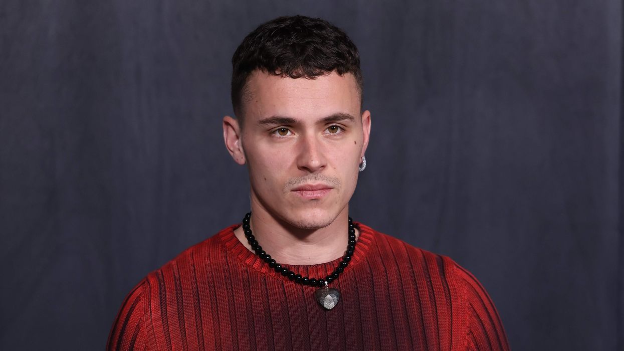 Aron Piper is seen on the front row of the Ferragamo fashion show.