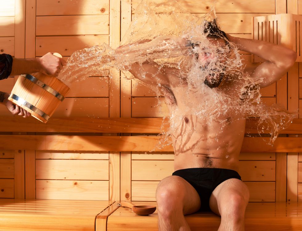 Awkward sauna behavior: Man splashed with water in sauna