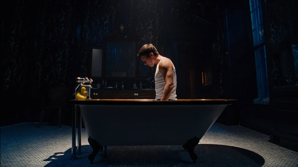 Barry Keoghan kneeling in a bathtub in 'Saltburn'