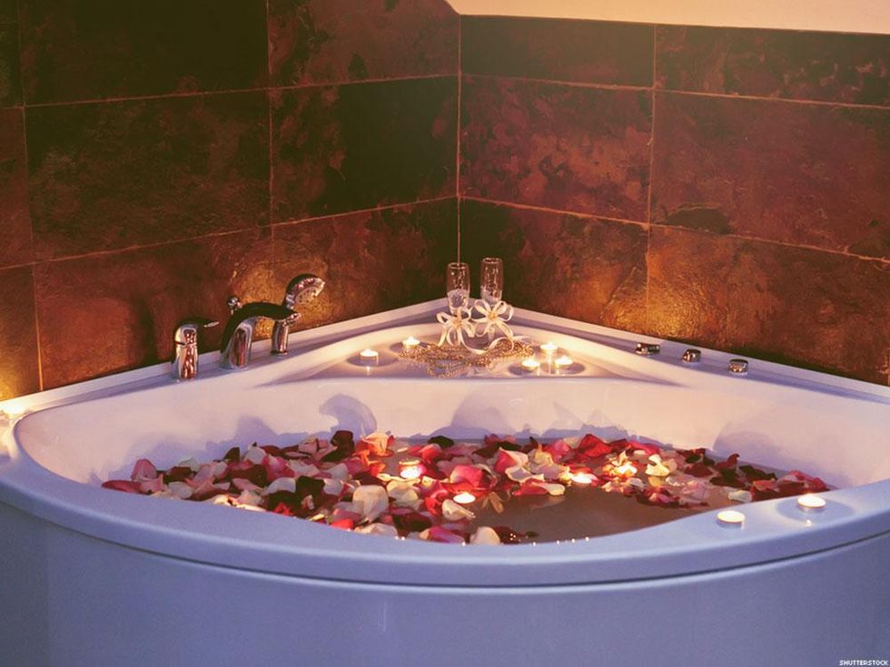 bath with candles and petals