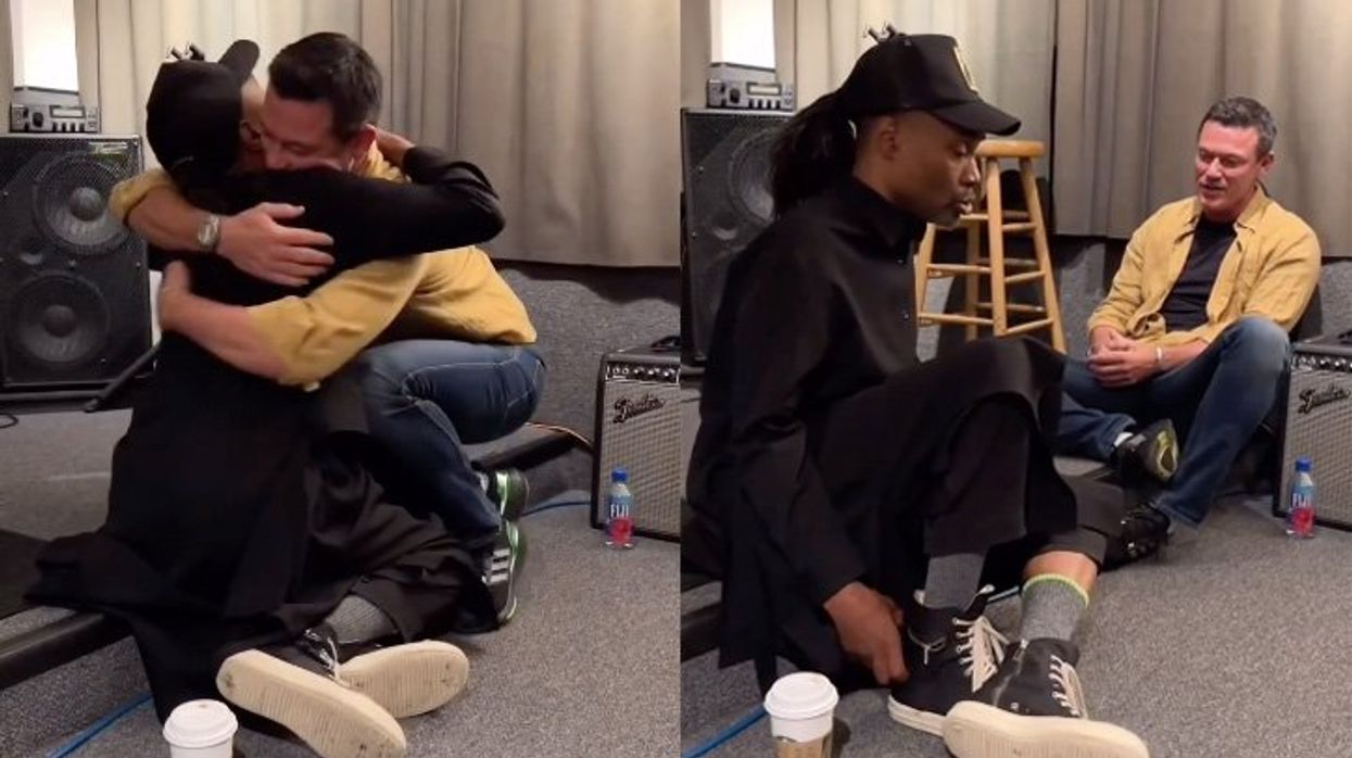 Billy Porter and Luke Evans hugging and singing together