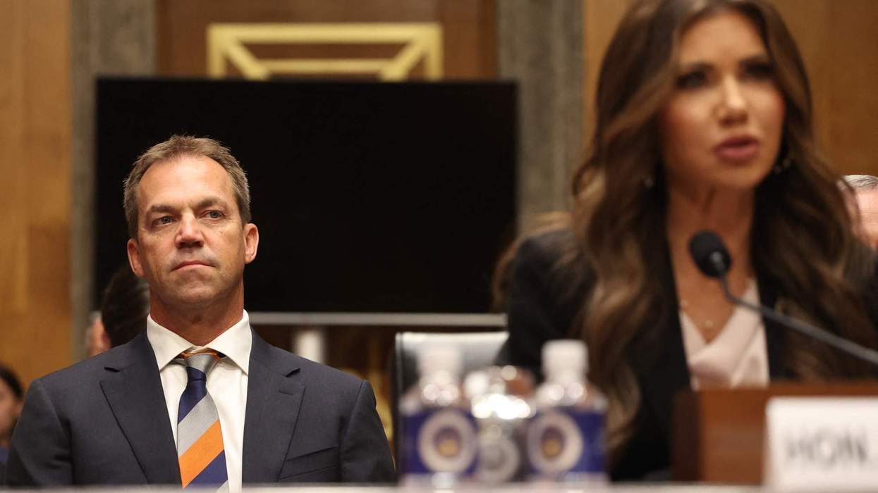 Bryon Noem (L), husband of US Secretary of Homeland Security Kristi Noem (R), listens as Secretary Noem testifies before the Senate Committee on Homeland Security and Governmental Affairs.