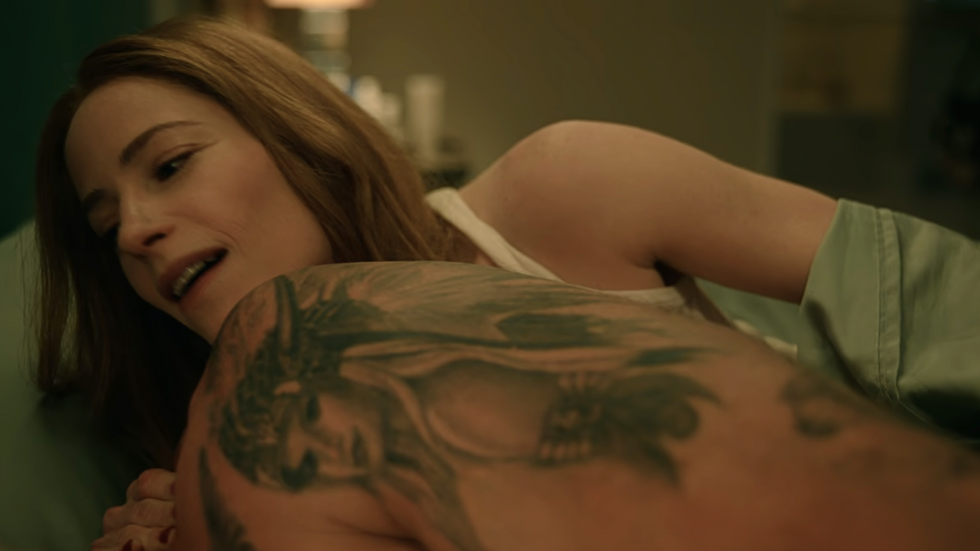 Callie's is behind her husband and watching him in bed, The Hunting Wives