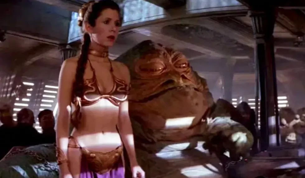 Carrie Fisher as Princess Leia in the famous gold bikini
