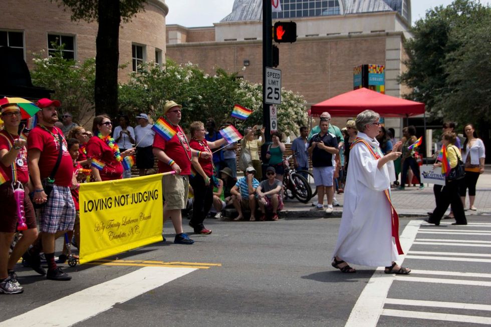 Charlotte North Carolina Pride Parade priest in front
