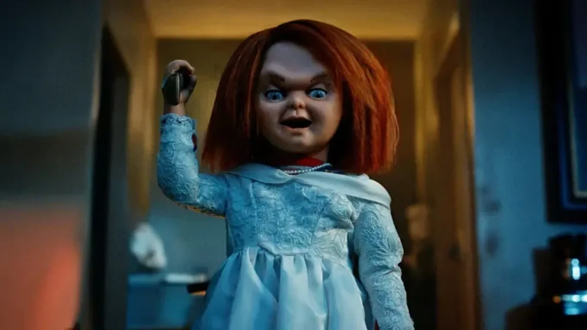 Chucky in a dress wielding a knife.