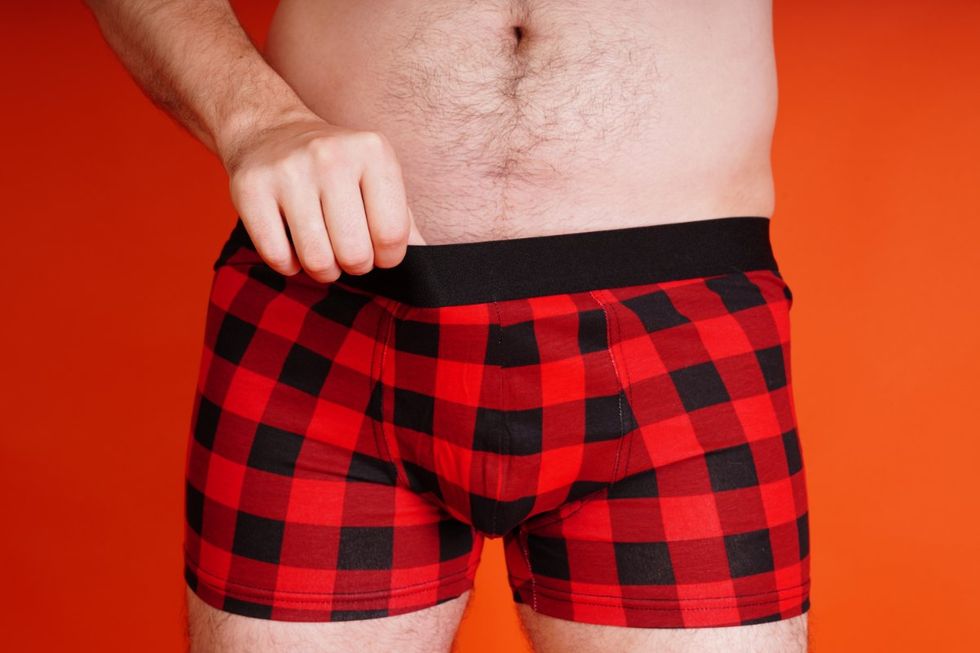 close up of man in red and black underwear