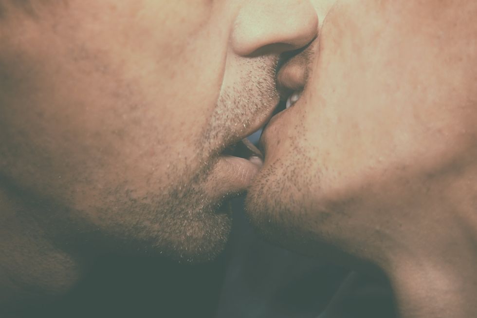 close up of men kissing