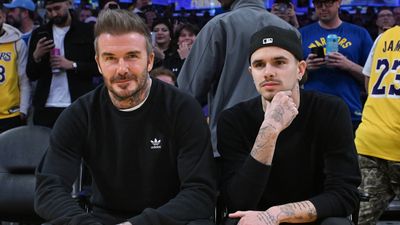 David Beckham and Romeo James Beckham attend a basketball game between the Los Angeles Lakers and the Golden State Warriors at Crypto.com Arena.