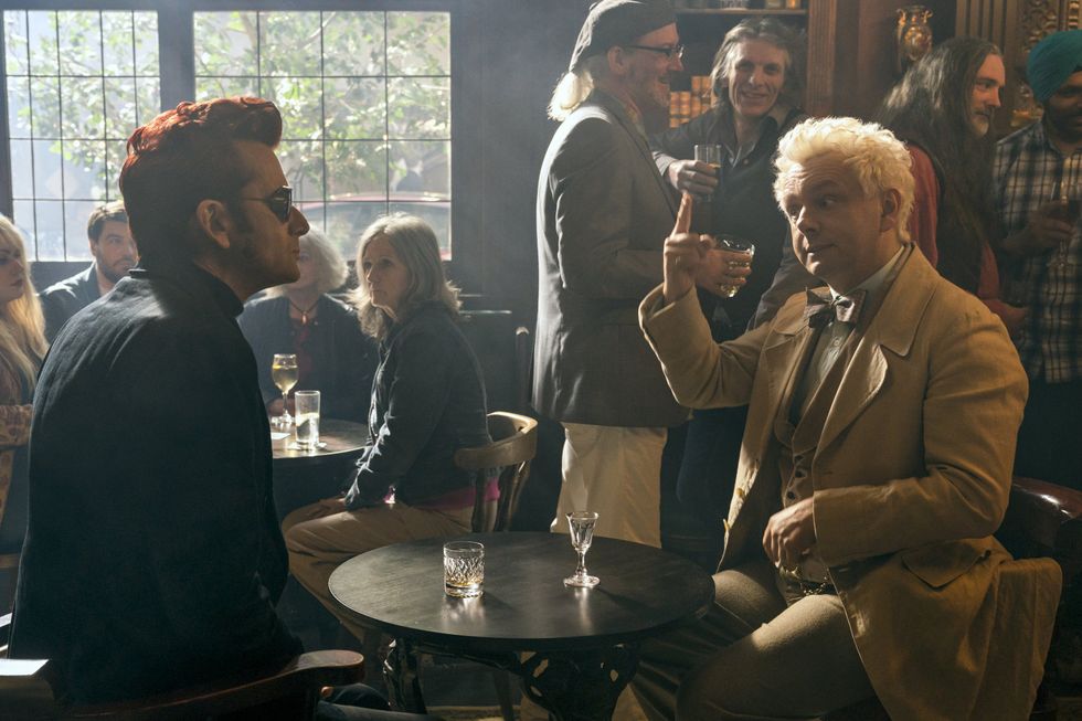 David Tennant as Crowley and Michael Sheen as Aziraphale having drinks.