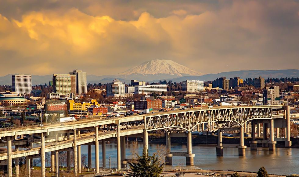 Downtown Portland Oregon with Marquam bridge over the Willamette River and view of Mount Saint Helens