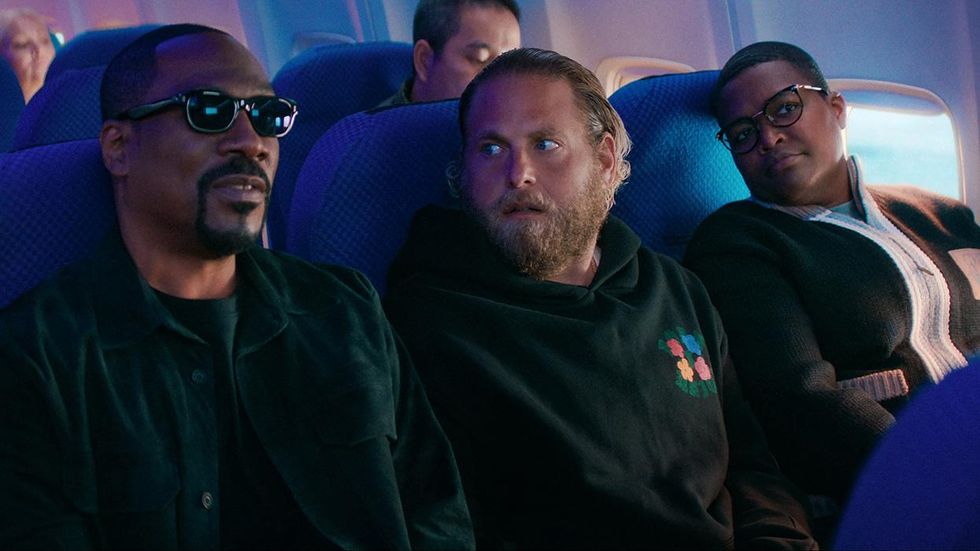 Eddie Murphy, Jonah Hill and Sam Jay on a plane in You People