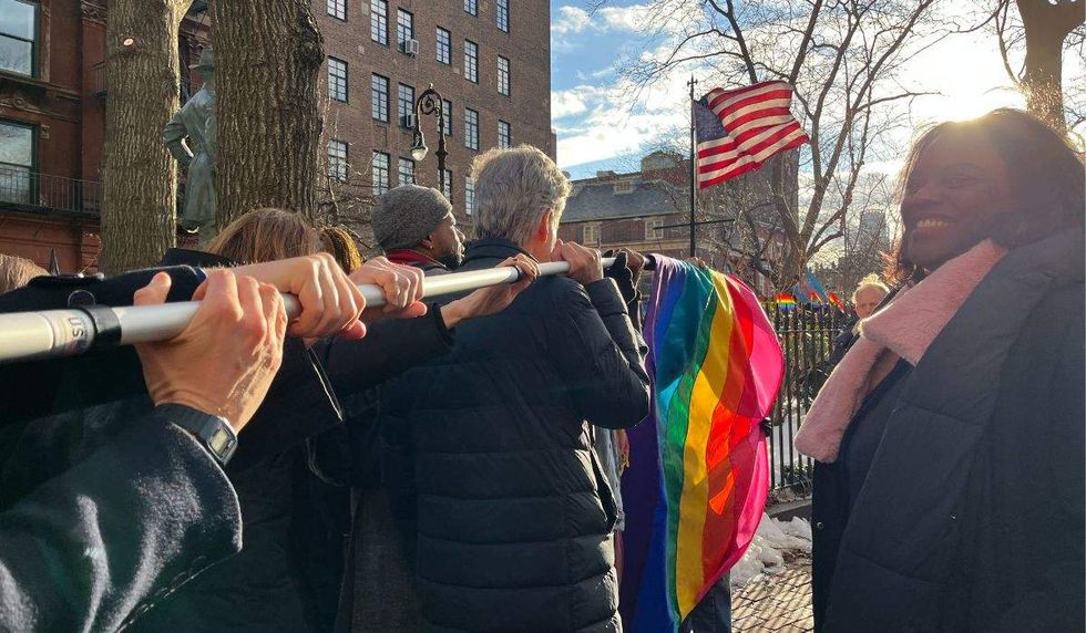 elected leaders carry pride flag