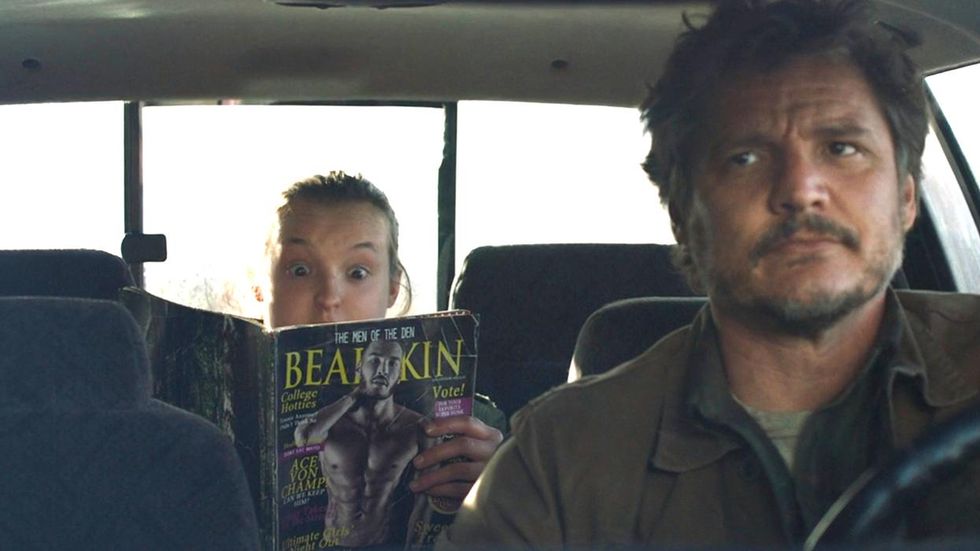 Ellie and Joel in a car, Ellie holds up a magazine in The Last of Us 