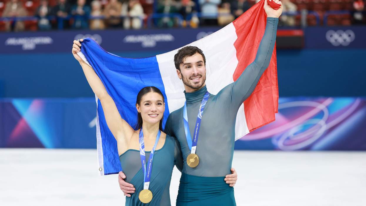 ench ice dancers Guillaume Cizeron and Laurence Fournier Beaudry with their gold medals and holding a French flag