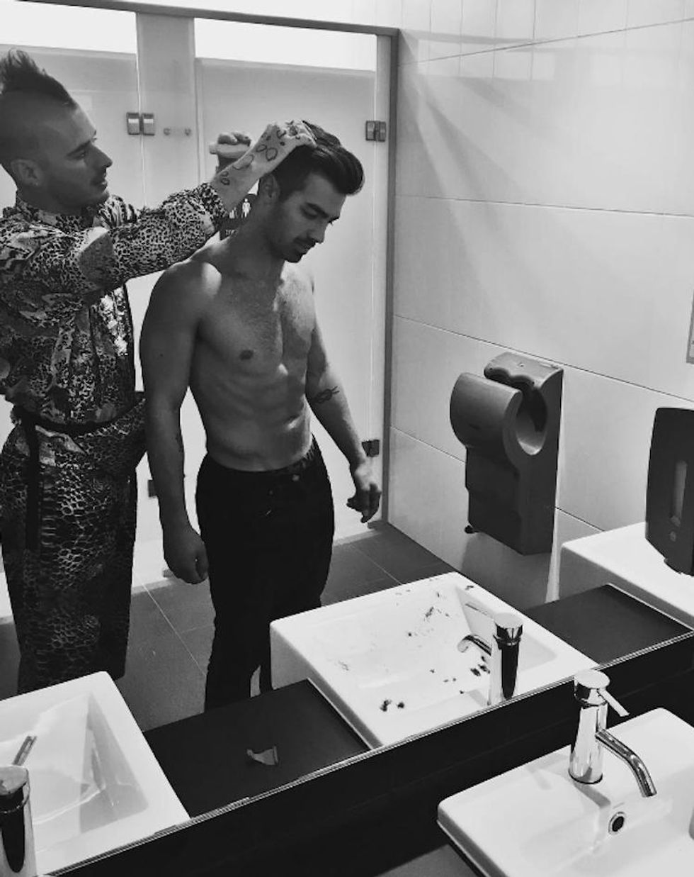 Even when he's getting a haircut (shirtless), he looks amazing.
