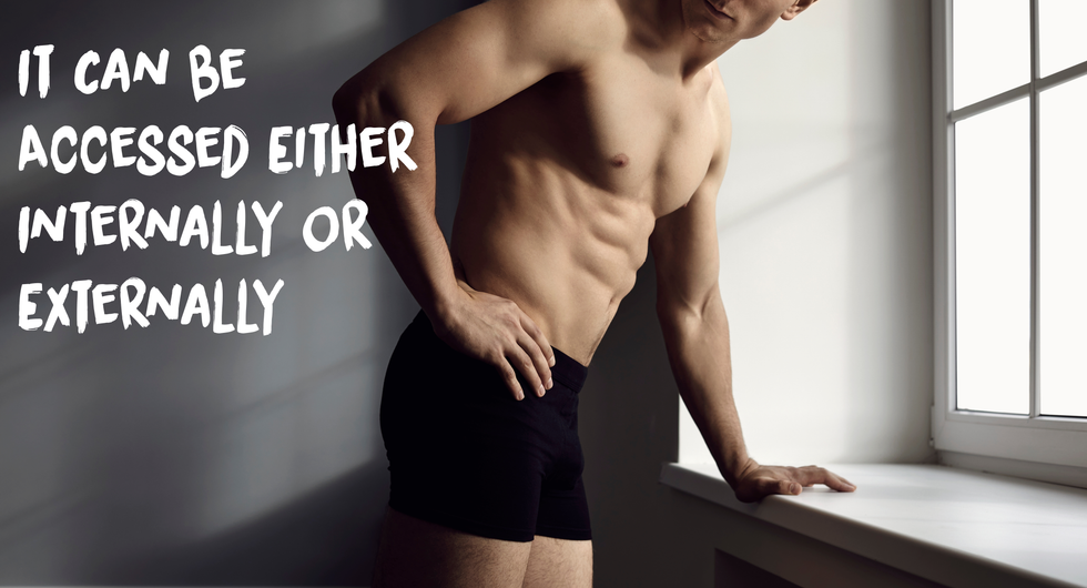 faceless and shirtless man in shadows