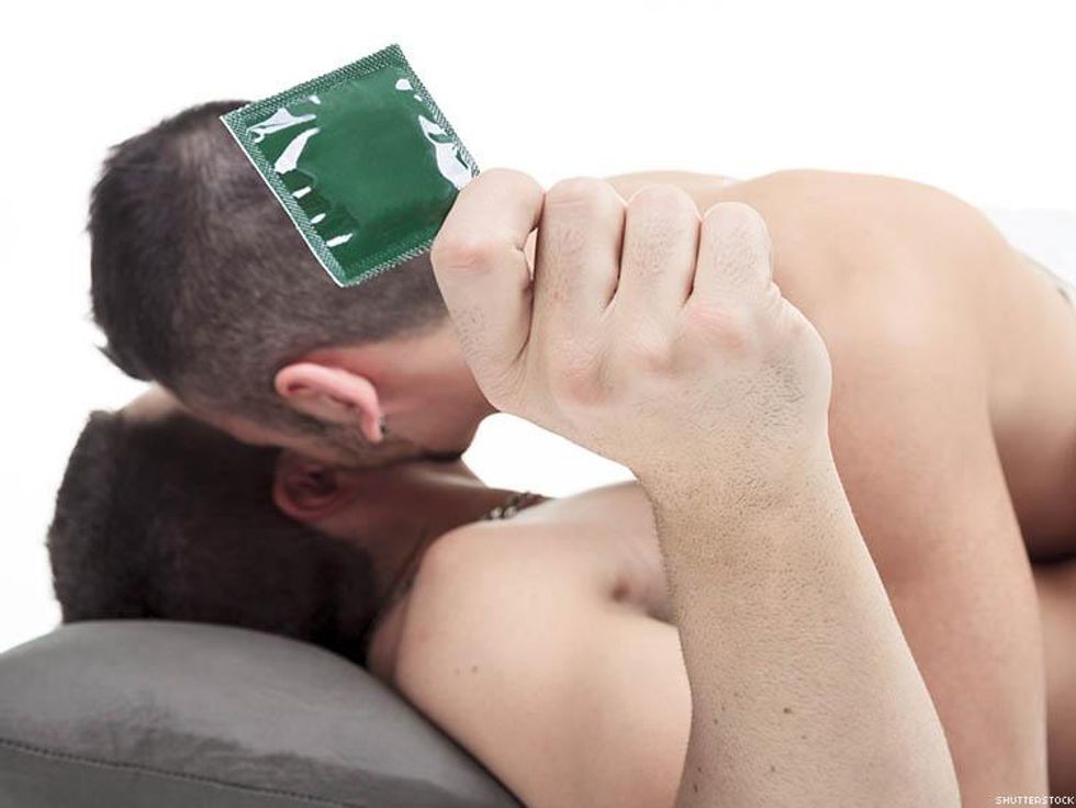 Gay couple having safer sex