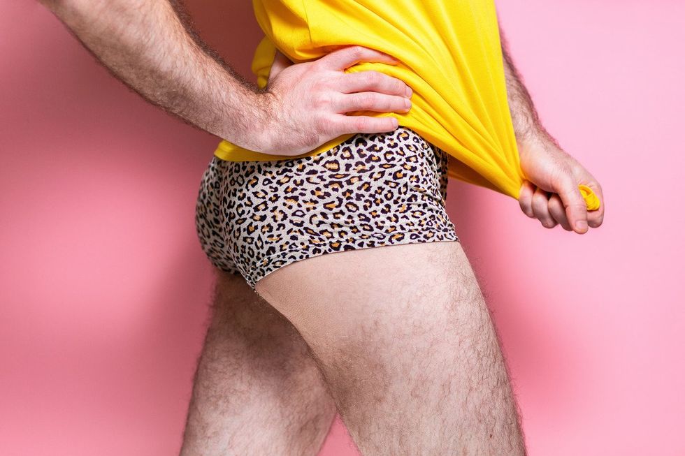 gay man in leopard print shorts