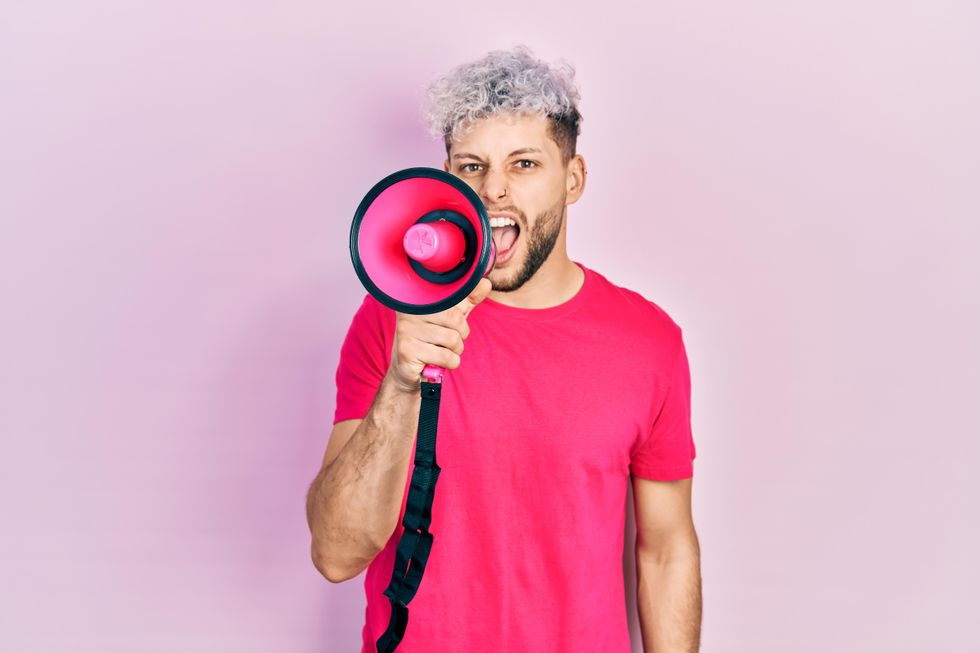 gay man using megaphone