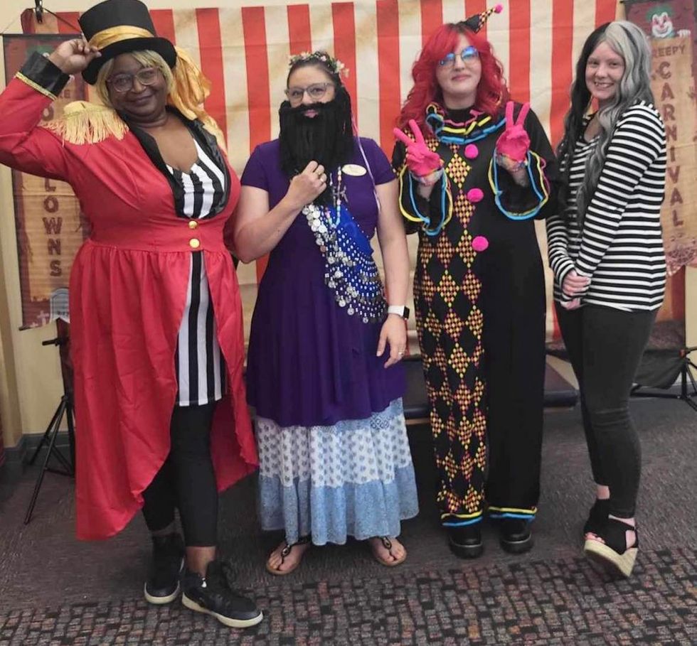 Georgia Pierce County librarian LaVonnia Moore dressed up with other adults in costume