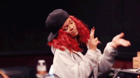 Gif of Rihanna wearing a hat and dancing.