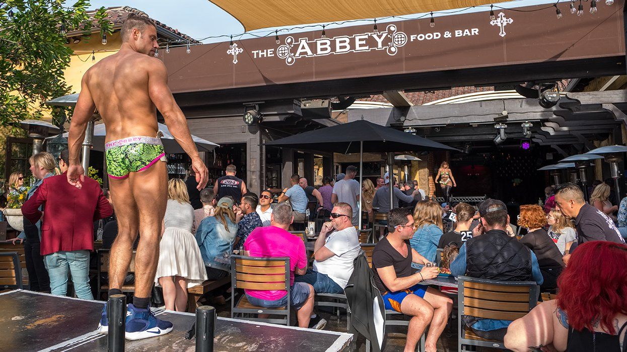gogo dancers during daytime brunch at The Abbey West Hollywood popular gay bar Los Angeles California