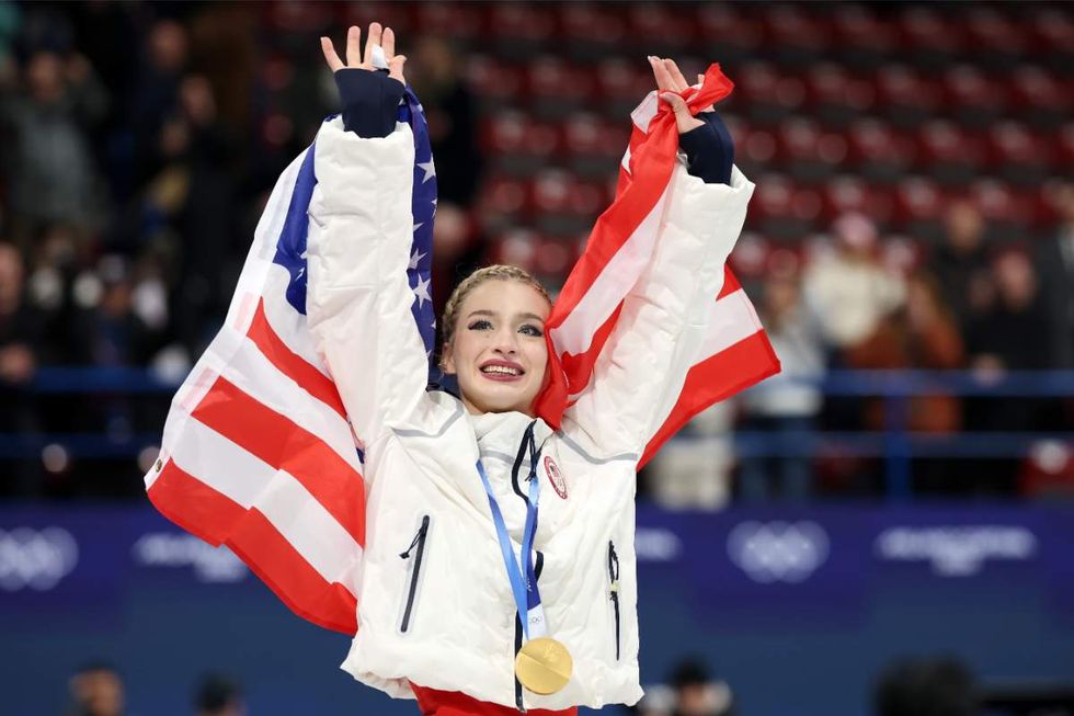 Gold medalist Amber Glenn of Team United States celebrates after the medal ceremony for the Team Event on day two of the Milano Cortina 2026 Winter Olympic games