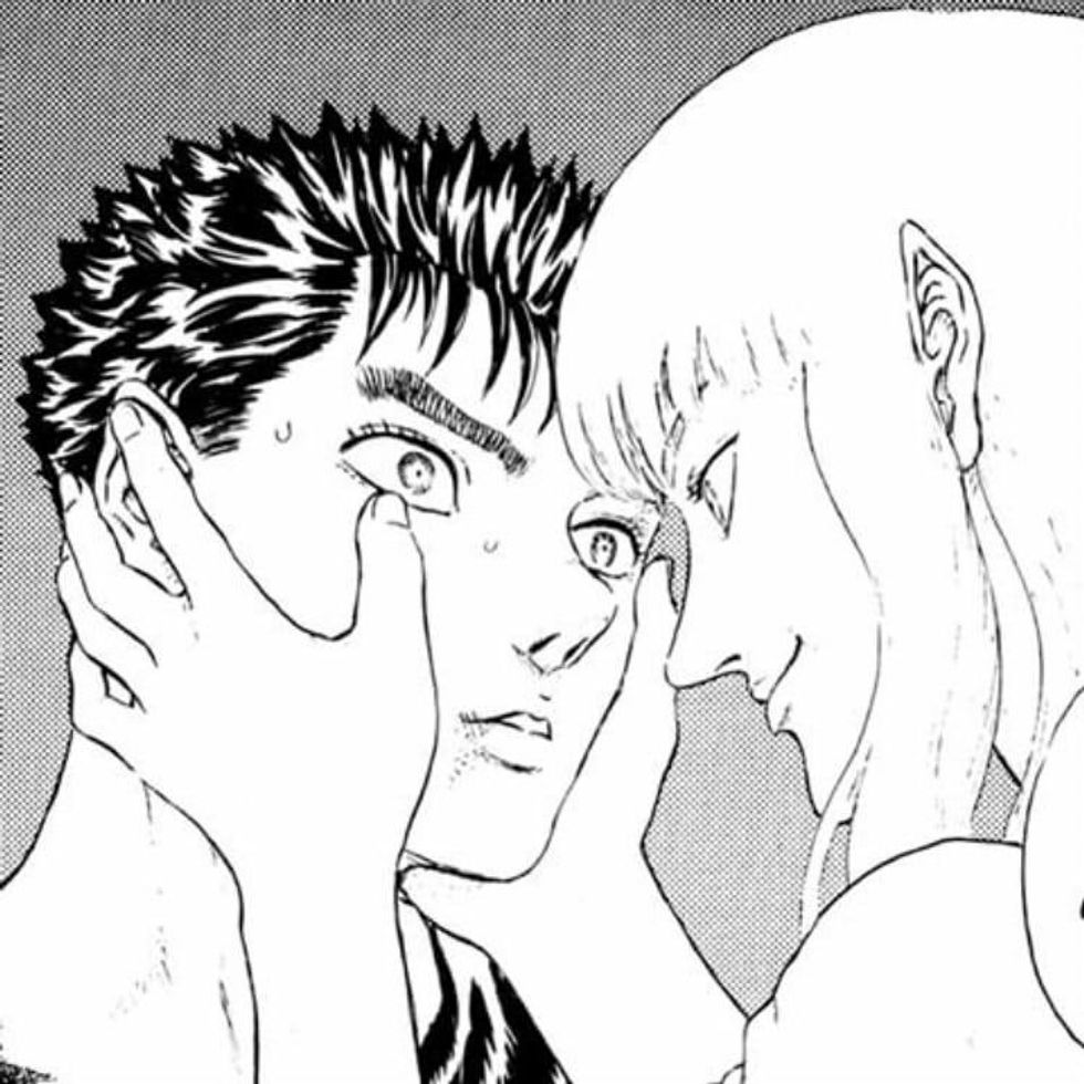 Griffith holding Guts face in his hands