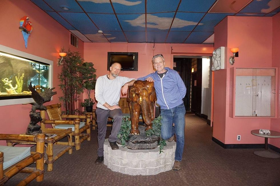 Harry and Ron in the lobby with the mahogany elephant