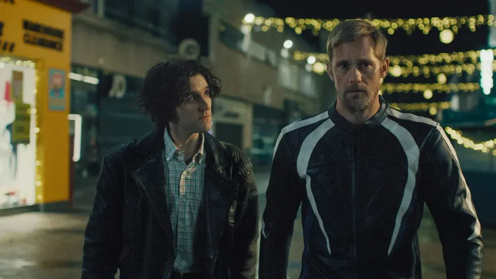 Harry Melling (left) and Alexander Skarsgard in 'Pillion.'