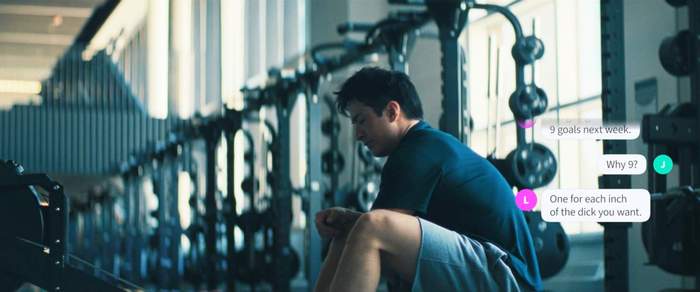 Hudson Williams as Shane Hollander at the gym while texts appear on screen