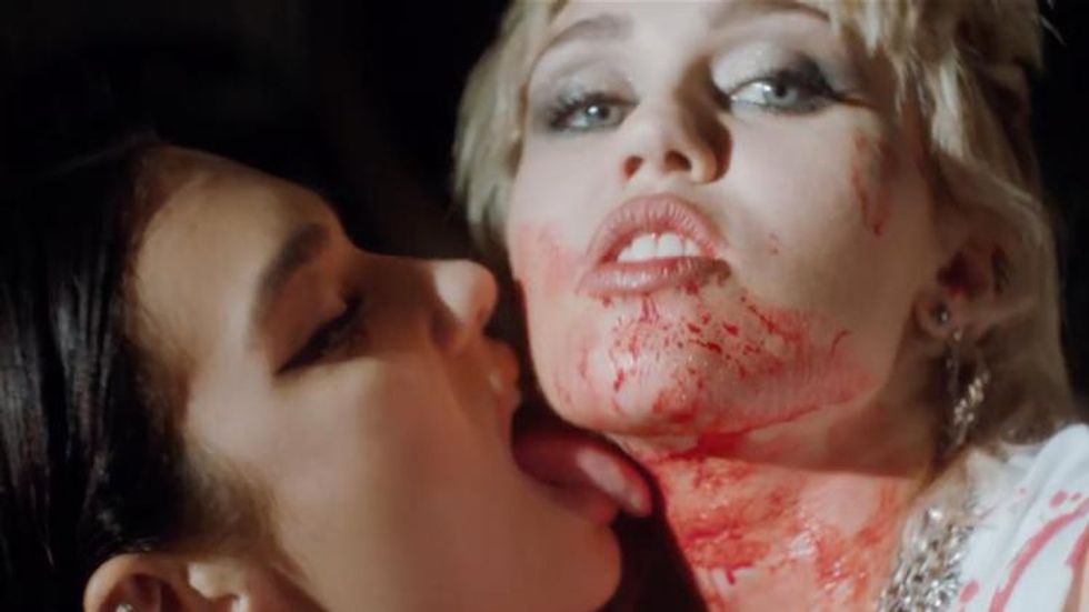 Watch Miley Cyrus & Dua Lipa's Steamy, Sapphic Road Trip in 'Prisoner'