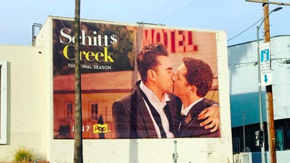 'Schitt's Creek' Queers Up Sunset Boulevard With Giant Gay Kiss