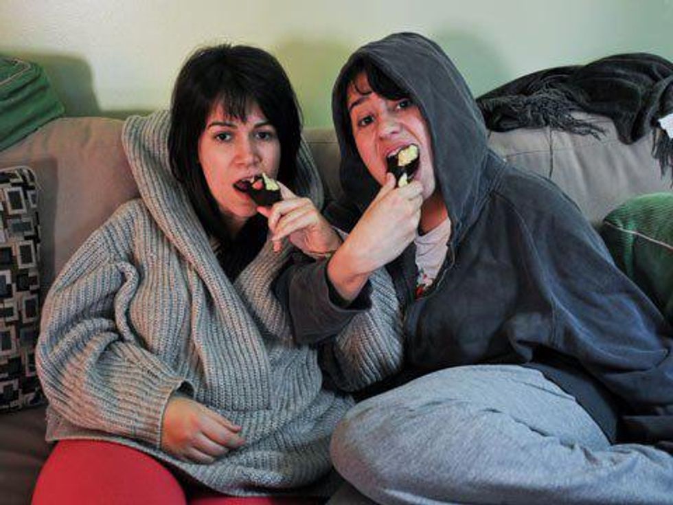 18 Signs You're a Lesbian or Bisexual Couch Couple 