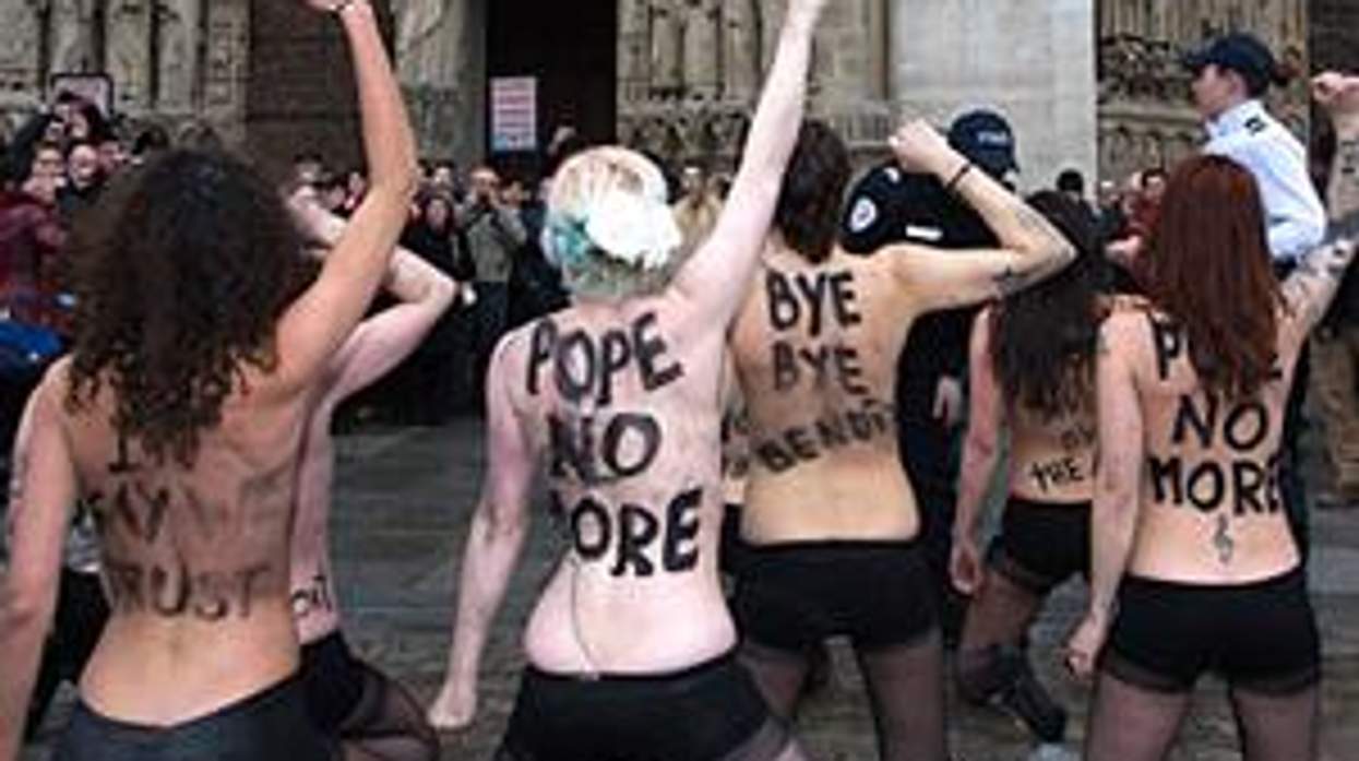 Watch: FEMEN Activists Strip Down Inside Notre Dame To Celebrate Pope's Resignation