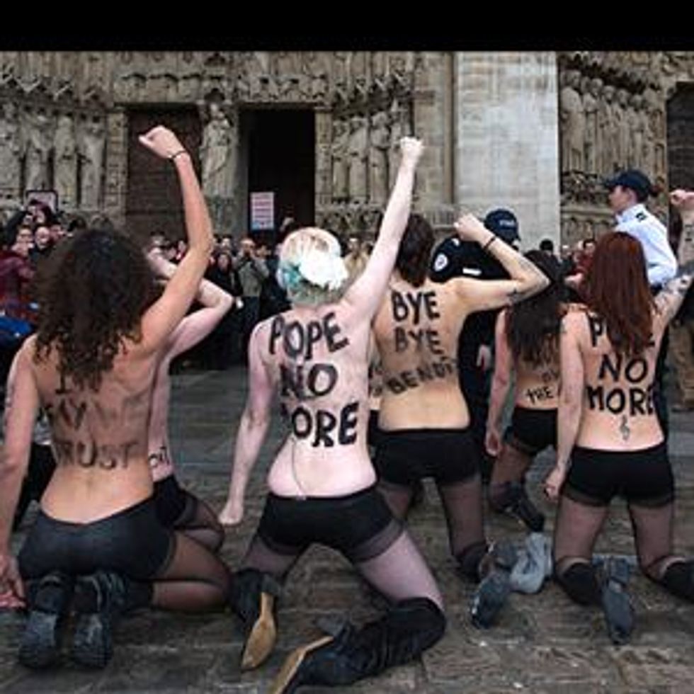 Watch: FEMEN Activists Strip Down Inside Notre Dame To Celebrate Pope's Resignation