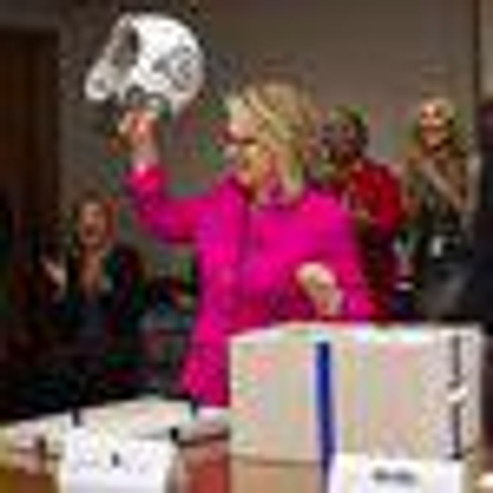 Shot of the Day: Hillary Clinton Gets Back to Work with Football Helmet to Protect Precious Cargo