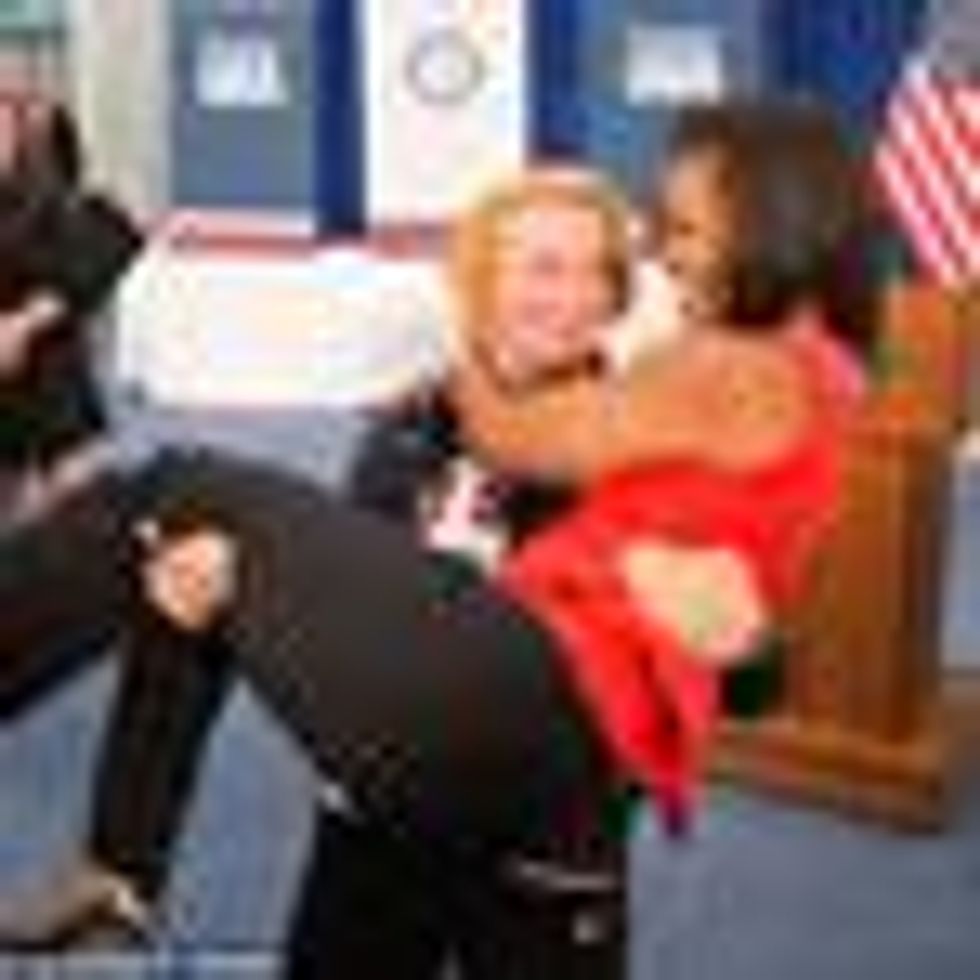 Shot of the Day: Michelle Obama Literally Picked Up by Female Olympic Wrestler 